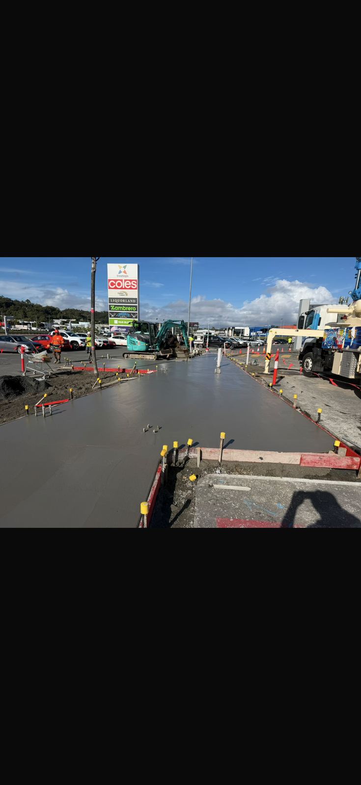Concrete footpath pour outside Coles shopping centre