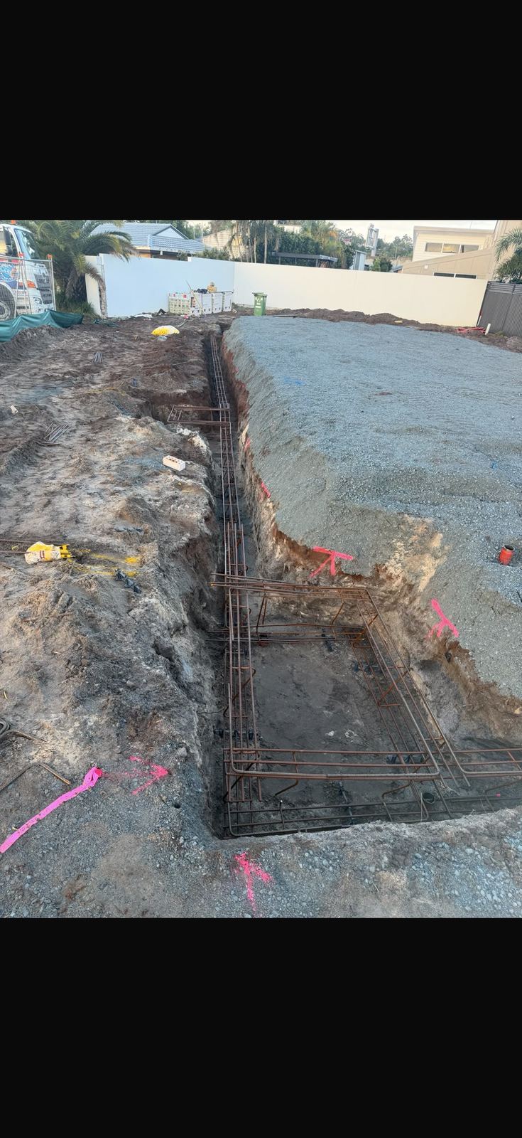 Footing trench with reinforcement steel beside excavation