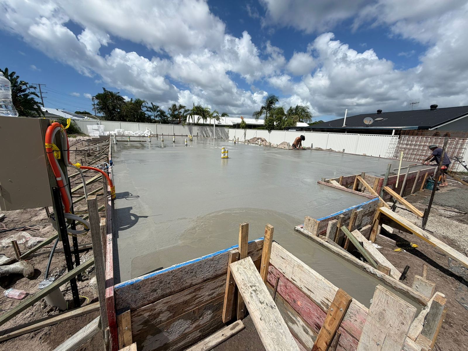 Large commercial slab pour with crew finishing