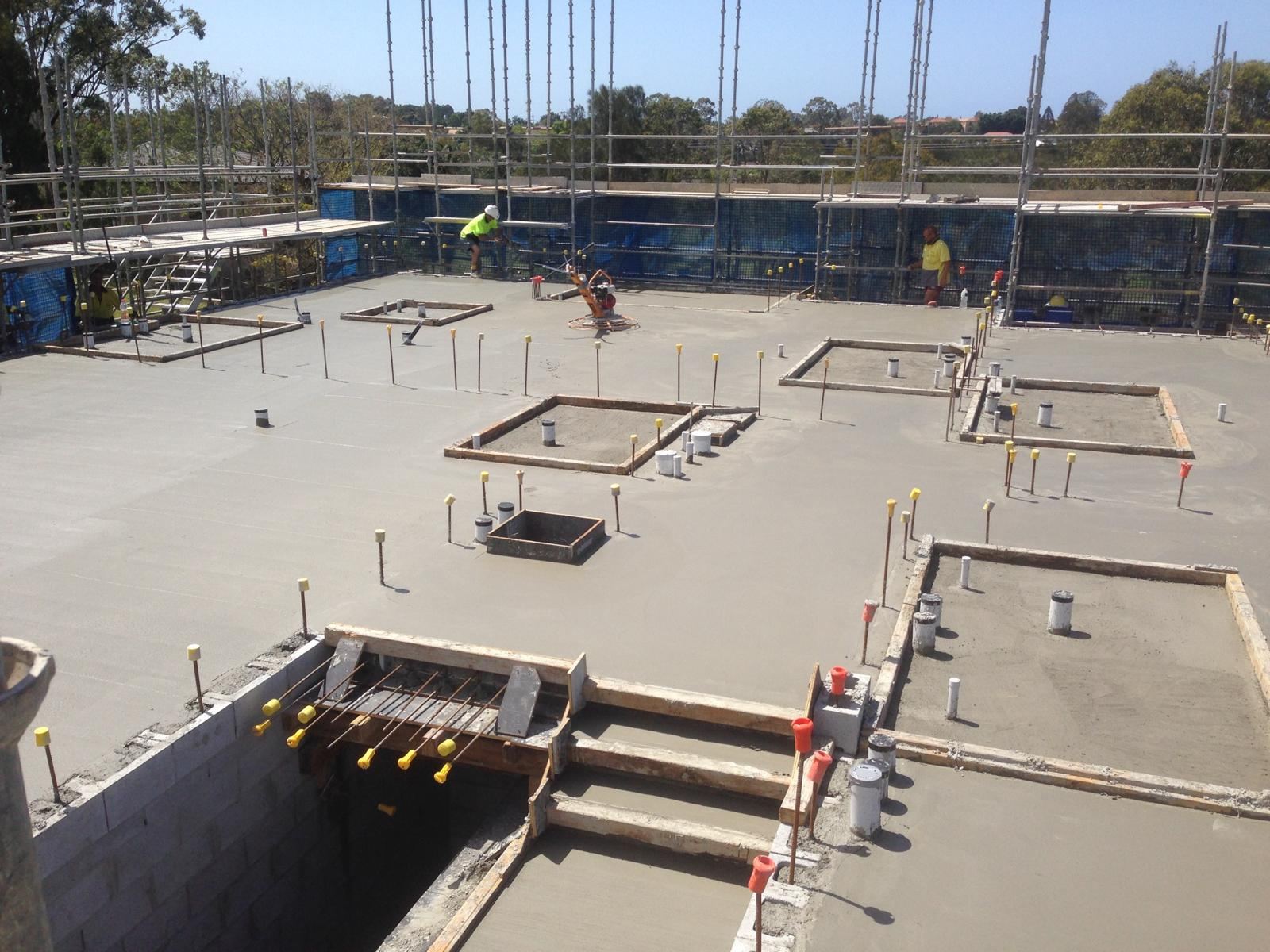 Aerial view of commercial slab with block stairwell openings