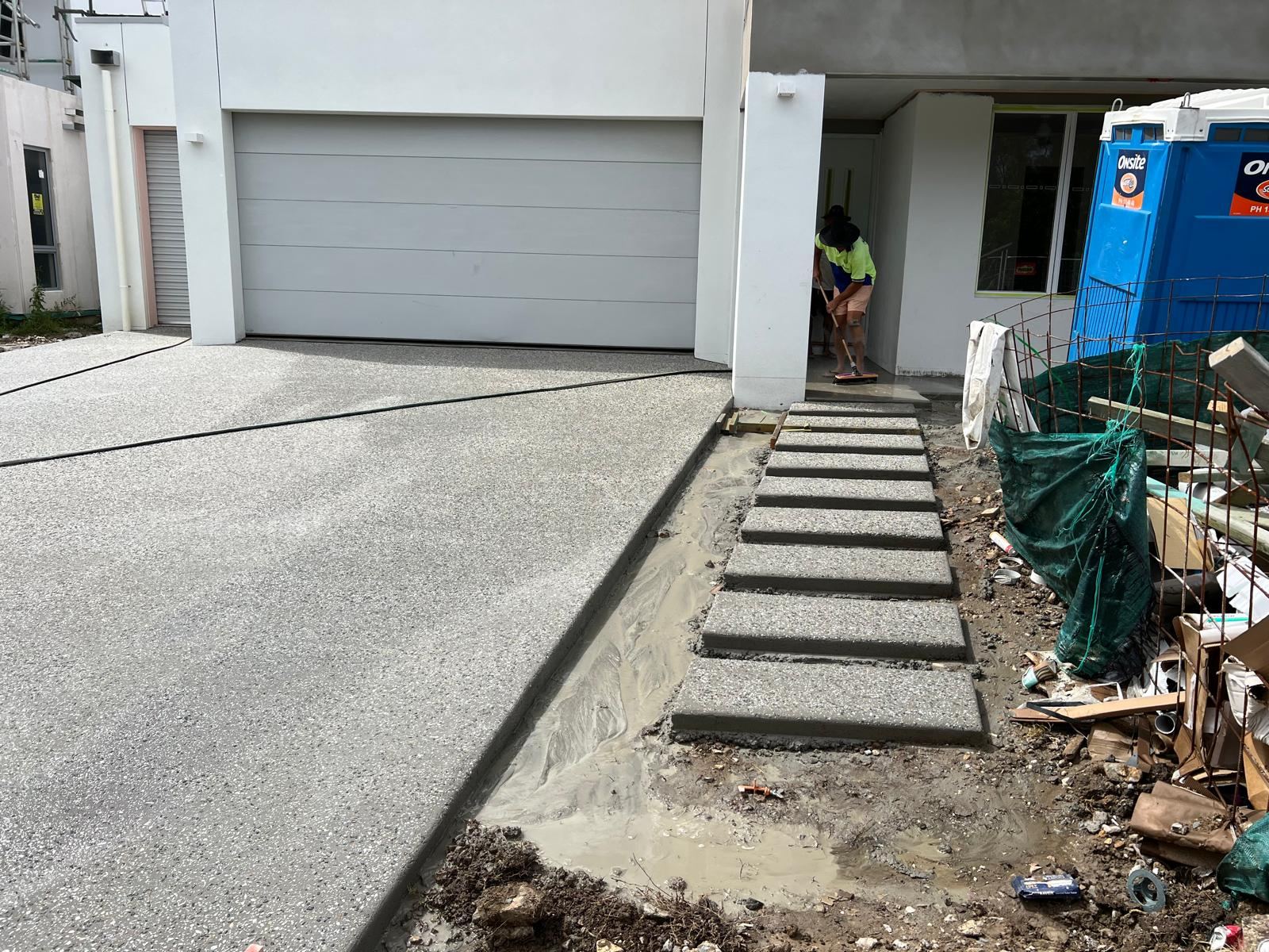 Driveway with stepping stone path to the front entry