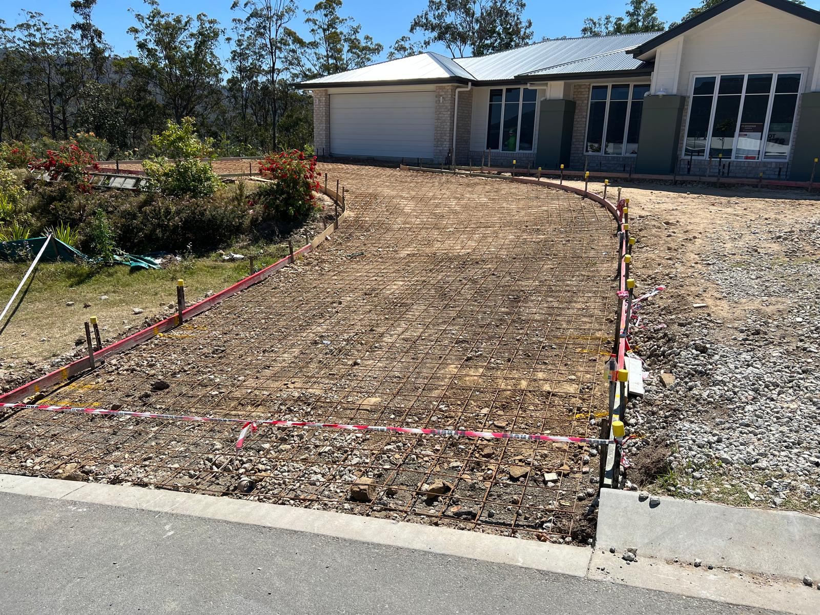 Reinforced driveway ready for pour on a rural property