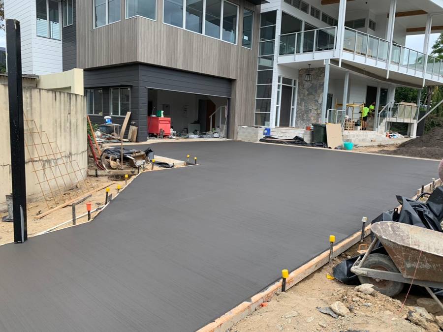 Charcoal coloured concrete driveway