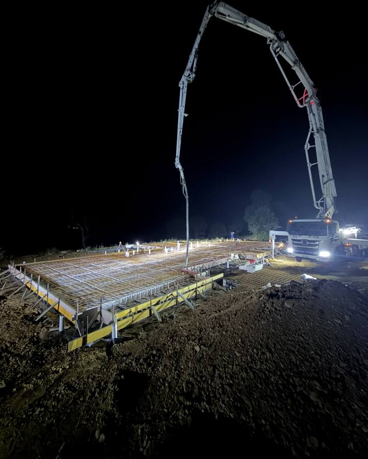 Night time concrete pour with pump truck