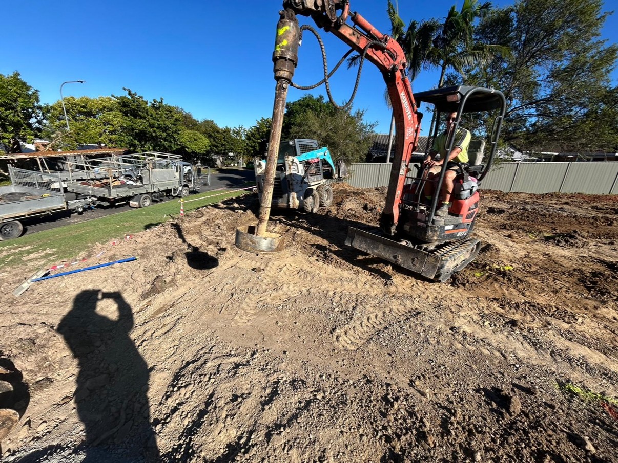 Piering rig drilling footings on a residential block