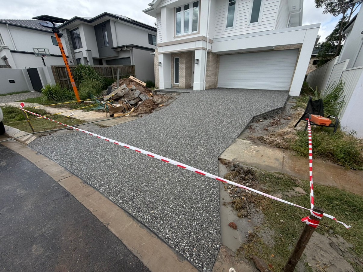 Exposed aggregate driveway with kerb crossover, freshly poured